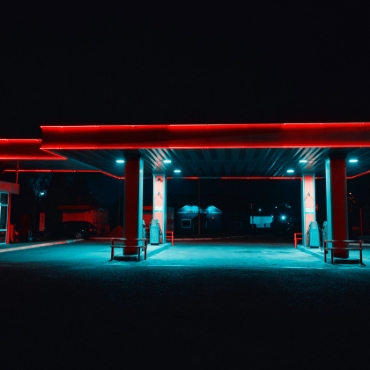 Gas station with architectural LED lighting at night.