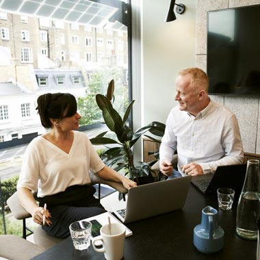 Sales manager helping a representative with coaching that helps them overcome their social anxiety disorder in a sales environment