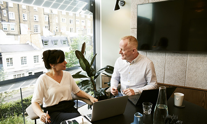 Sales manager helping a representative with coaching that helps them overcome their social anxiety disorder in a sales environment