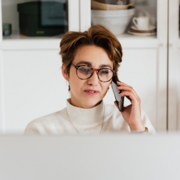 Sales woman taking a call on her mobile phone