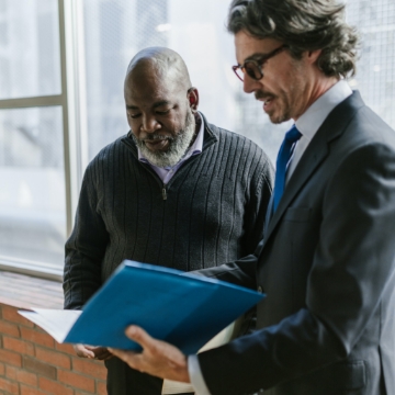 Sales coach going through reports with sales rep